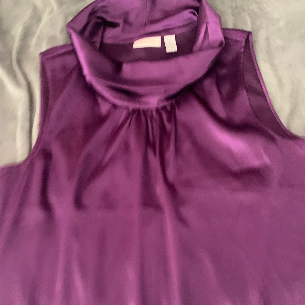 Purple silk turtle neck top.